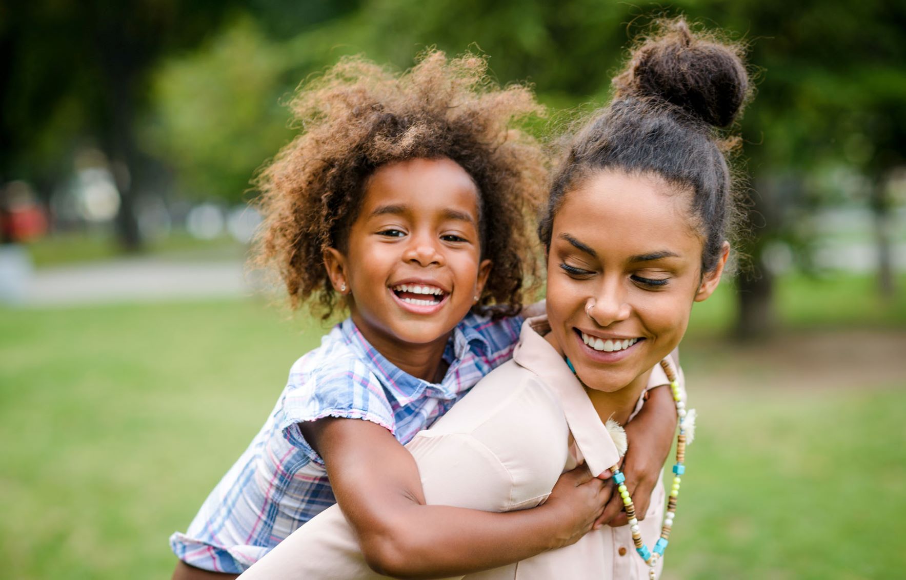 Mom holding daughter