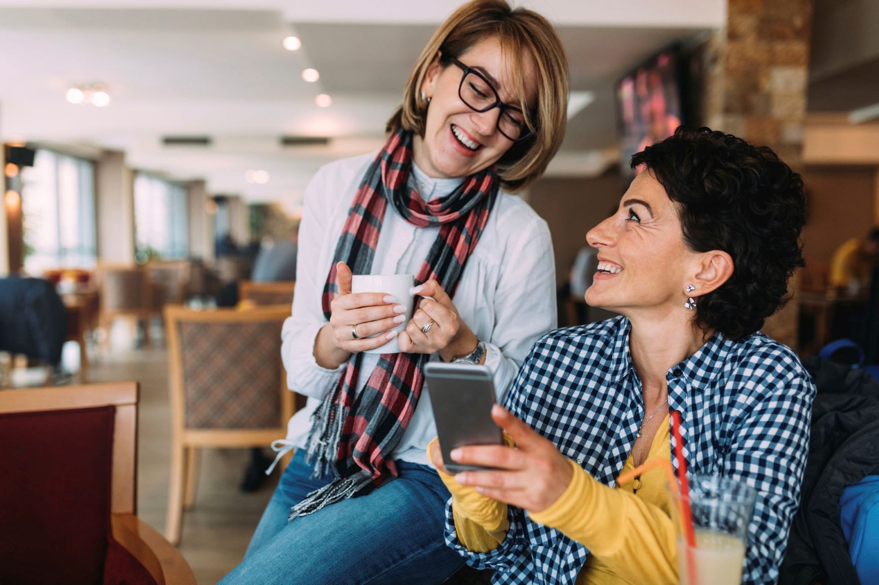 Two women looking at a phone