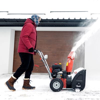 Person pushing a snow blower