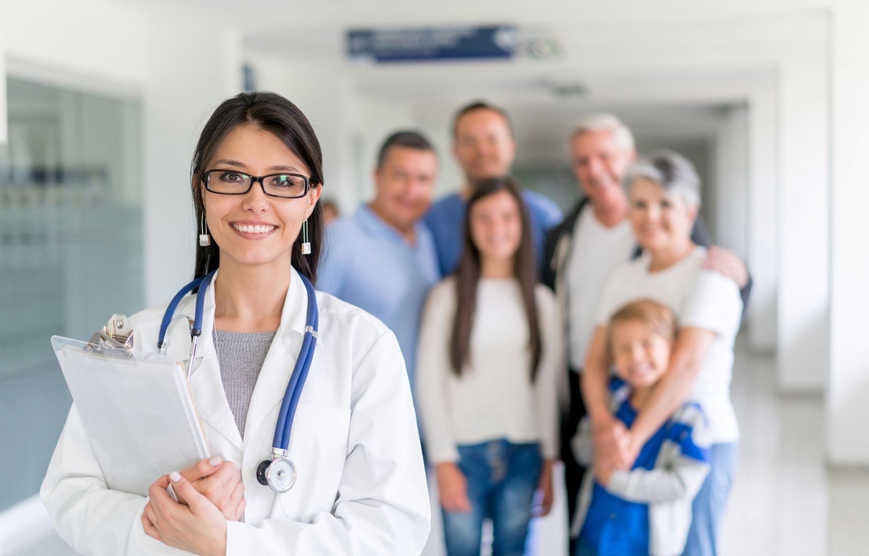 Doctor standing with family
