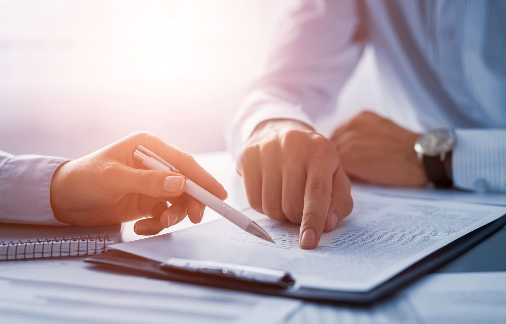 Person pointing at paper