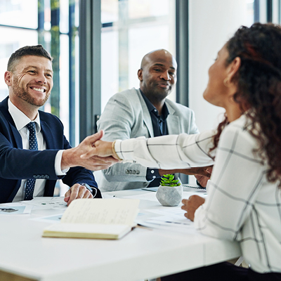 People wearing business clothes shaking hands