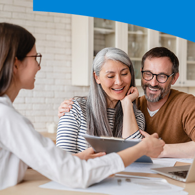 People talking and looking at paperwork