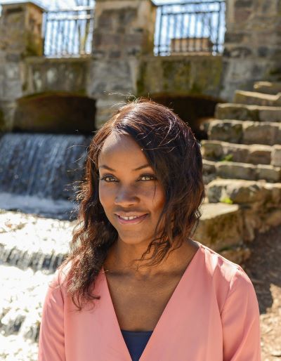 Person outside wearing a pink shirt