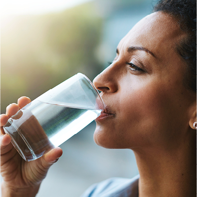 Woman drinking a glass of water
