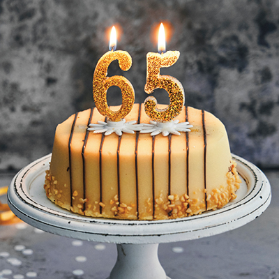 Birthday Cake with 65 candles on it