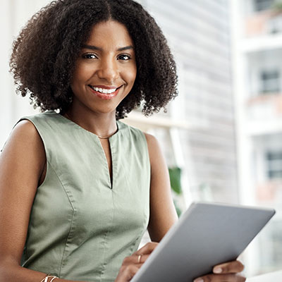 Person holding paper and smiling