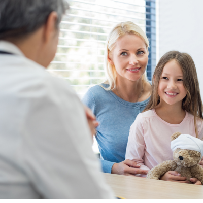 Mother and daughter talking to doctor